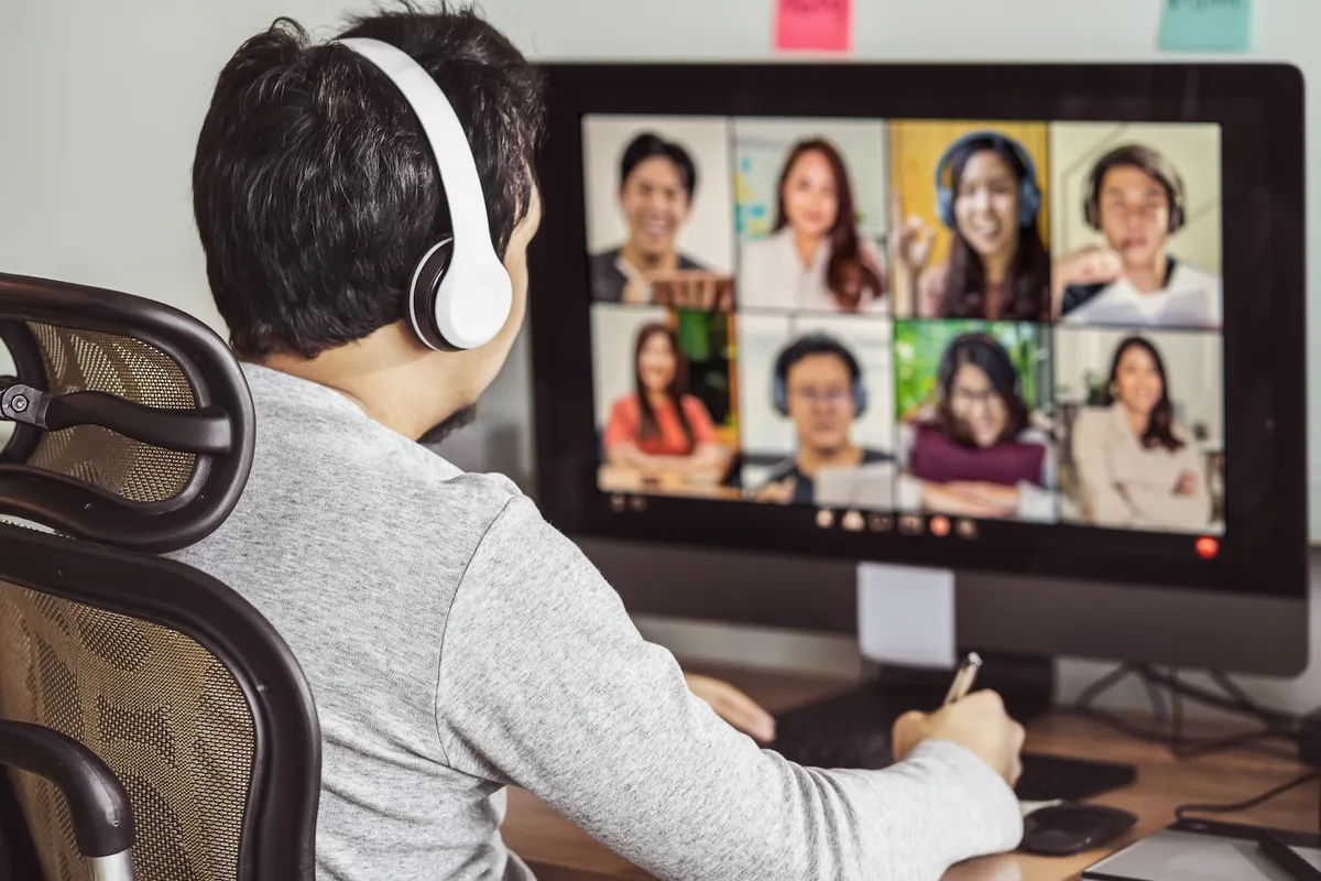 Software professionals in a live virtual group coaching session on a video call